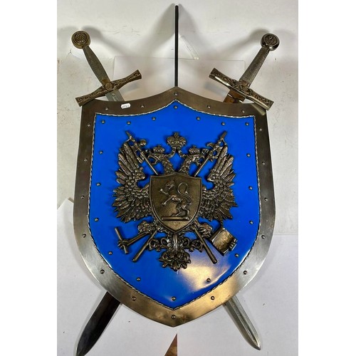 552 - A decorative wall hanging sword and shield, 88 x 62cm.

This bladed product is not for sale to peopl... 