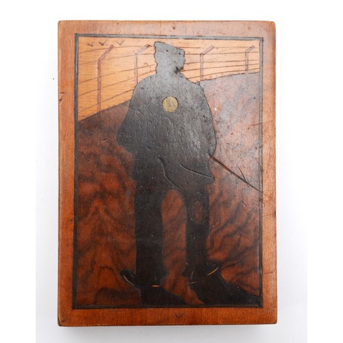 553 - A WWI P.O.W. marquetry box, depicting a soldier inside a wire fence, 11 x 8 x 3cm, together with a s... 