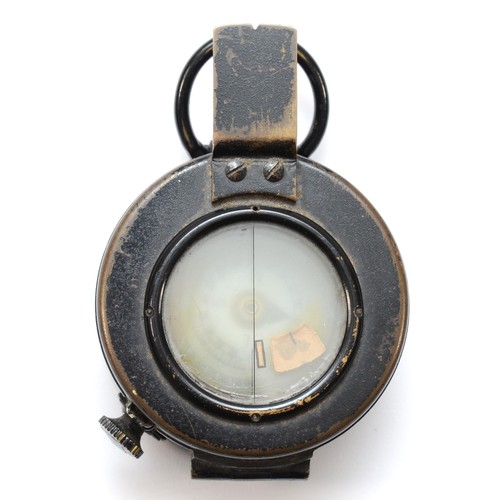 554 - A WWII British military compass, by T.G.Co Ltd, London, numbered 261024, broad arrow, 1943, MkIII.