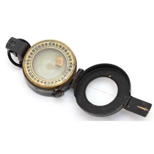 554 - A WWII British military compass, by T.G.Co Ltd, London, numbered 261024, broad arrow, 1943, MkIII.