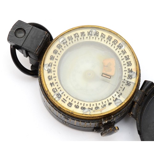 554 - A WWII British military compass, by T.G.Co Ltd, London, numbered 261024, broad arrow, 1943, MkIII.