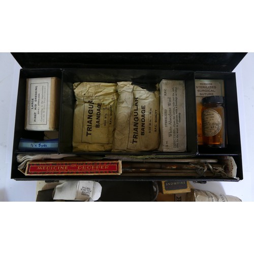 555 - A WWII medical kit in a metal box, 31 x 16 x 8cm