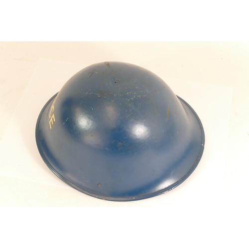 559 - A blue painted turtle helmet marked Police and two wooden truncheons