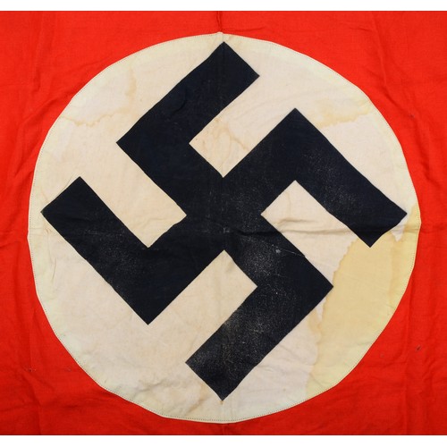 570 - A WWII Third Reich Nazi German NSDAP one sided party flag in red and white, with central black swast... 