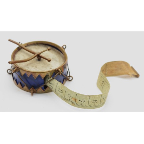 574 - A novelty tape measure, in the form of a marching drum, diameter 45mm