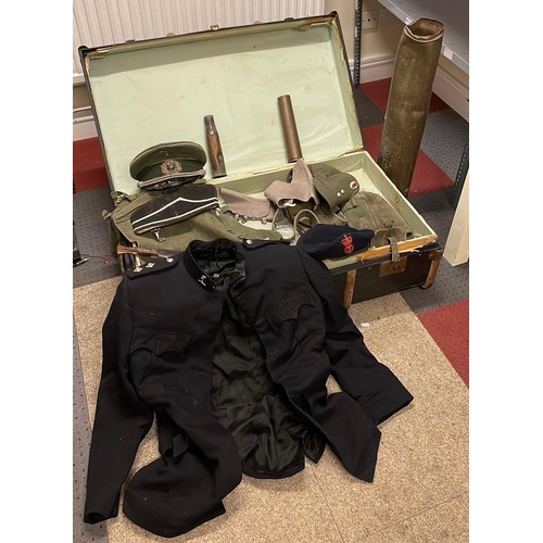 578 - An early 20th century traveling trunk and contents to  include a military uniform, a WW2 German infa... 