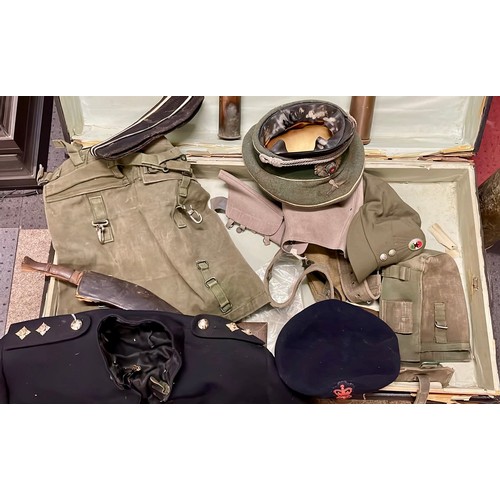 578 - An early 20th century traveling trunk and contents to  include a military uniform, a WW2 German infa... 