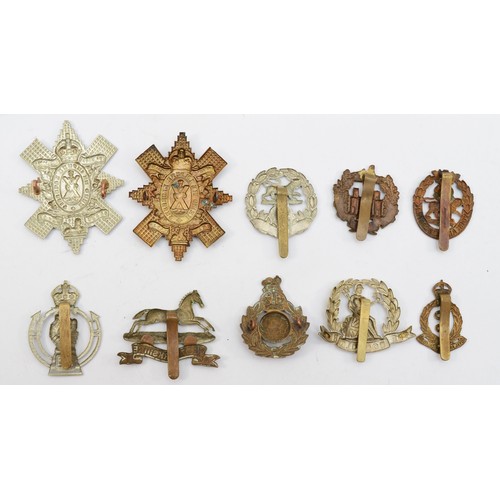 582 - Ten military cap badges, including the Black Watch and Norfolk