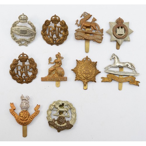 584 - Ten military cap badges, including the Hampshire and West Yorkshire