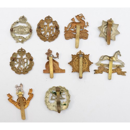 584 - Ten military cap badges, including the Hampshire and West Yorkshire