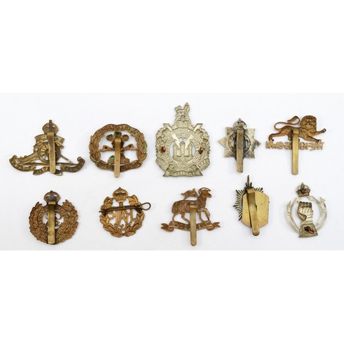 586 - Ten military cap badges, including the Queens and Royal Armoured Corp