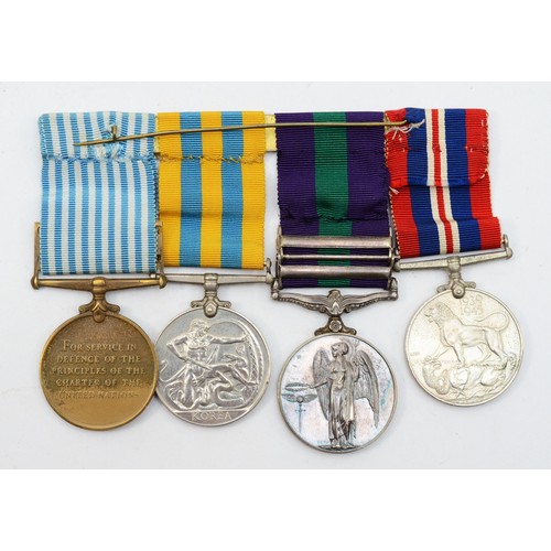 597 - WWII/ERII mounted group of four, Defense, G.S.M. with Malaya and Cyprus bars, Korea, United Nations ... 