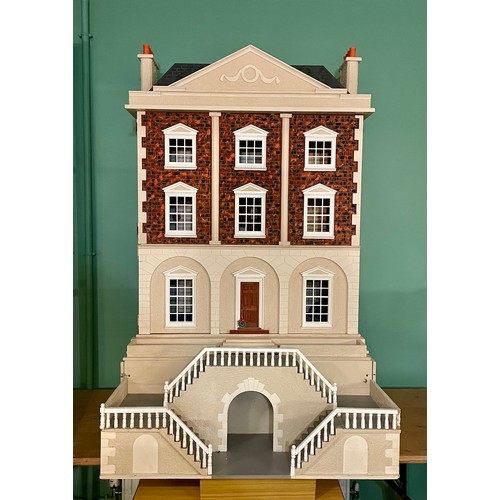 209 - A large impressive Georgian style four storey dolls house, the hinged double panel frontage with bal... 