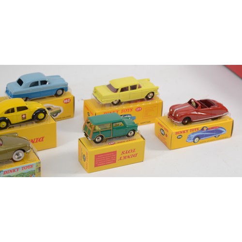 184 - A collection of eleven reproduction Dinky diecast model vehicles, boxed, together with an Atlas tin ... 