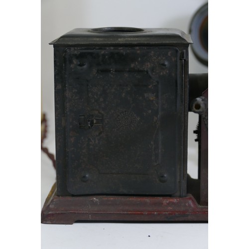 248 - An early 20th century tinplate combined magic lantern and 35mm cinematograph projector, hand-cranked... 