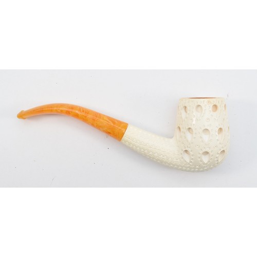 353 - Three carved Meerschaum pipes, and a plain example, all cased