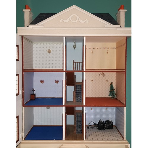 209 - A large impressive Georgian style four storey dolls house, the hinged double panel frontage with bal... 