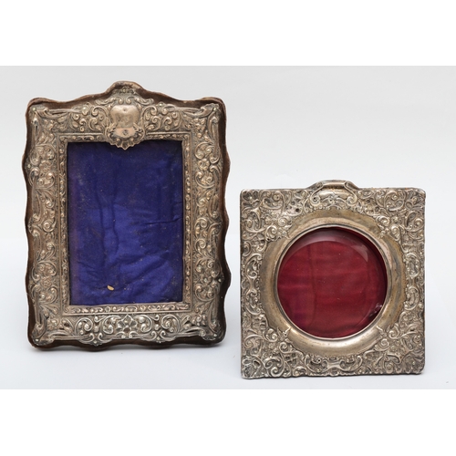 20 - A Victorian silver photograph frame, Chester 1900, with embossed and pierced floral scroll frame, 22... 