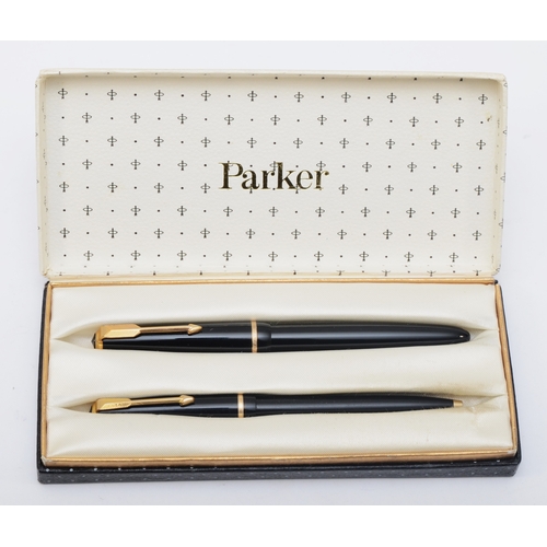 72 - A Parker Duofold black fountain pen, 14K gold nib, together with a matching biro, case