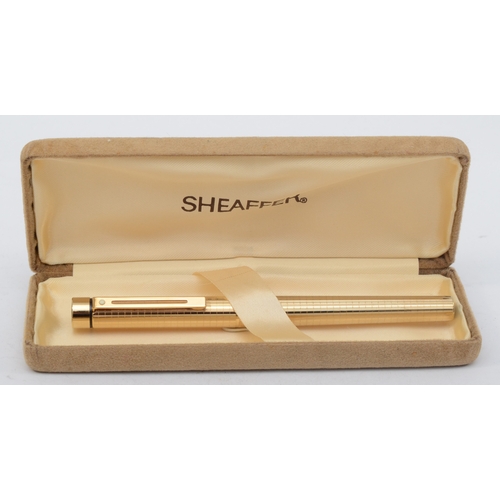 75 - Sheaffer, a gold plated fountain pen, with 14K gold nib and cartridge filling, case