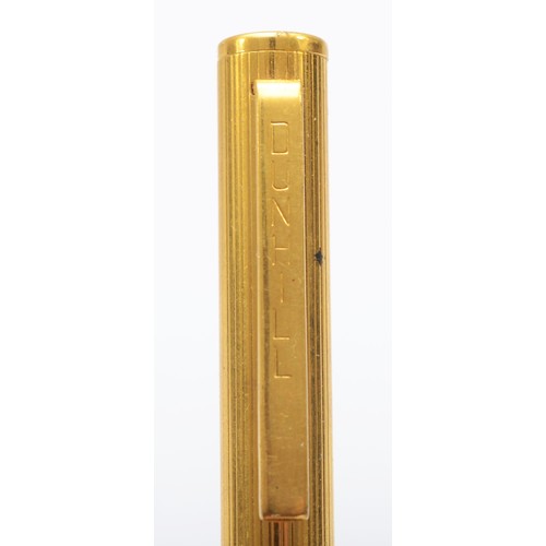 76 - Dunhill, a gold plated biro, ribbed body