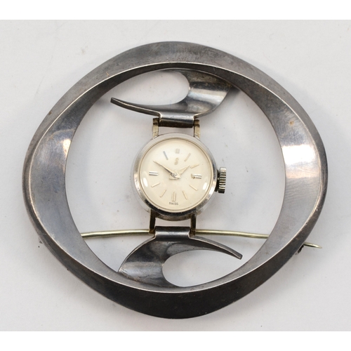 92 - A ladies stainless steel manual wind watch, mounted in an abstract brooch, 52 x 48mm overall, workin... 