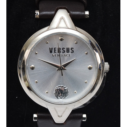 102 - Versus Versace, a stainless steel gentlemen's quartz wrist watch with leather strap, SC107 0016, tog... 