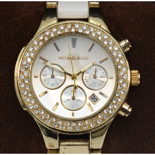 103 - Michael Kors, a stainless steel ladies chronograph wrist watches, RUNWAY MK-5128, together with a fa... 