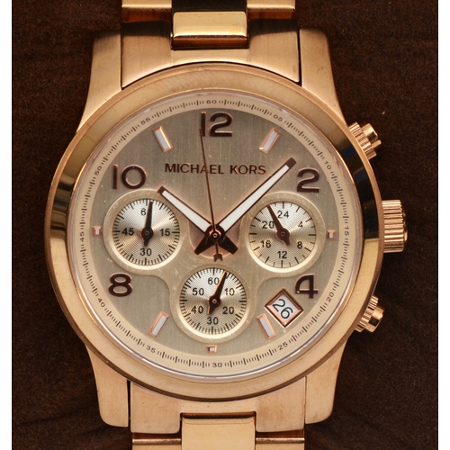 103 - Michael Kors, a stainless steel ladies chronograph wrist watches, RUNWAY MK-5128, together with a fa... 