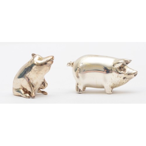 58 - Two silver pig ornaments, by Practical Silverware, London 2005, standing pig 22 x 45mm, 56.9gm.