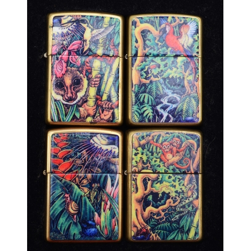 128 - Zippo, a collectors set of four petrol lighters, Mysteries of the Forest, 1995, two unused, in tin w... 