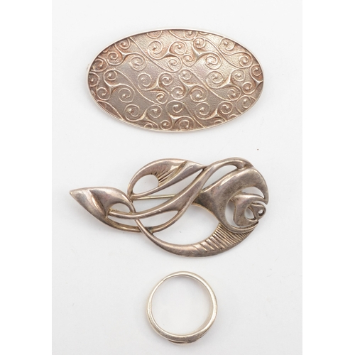 170 - Ola Gorie, two Scottish silver brooches to include a floral example, 48 x 23mm, together with a sliv... 