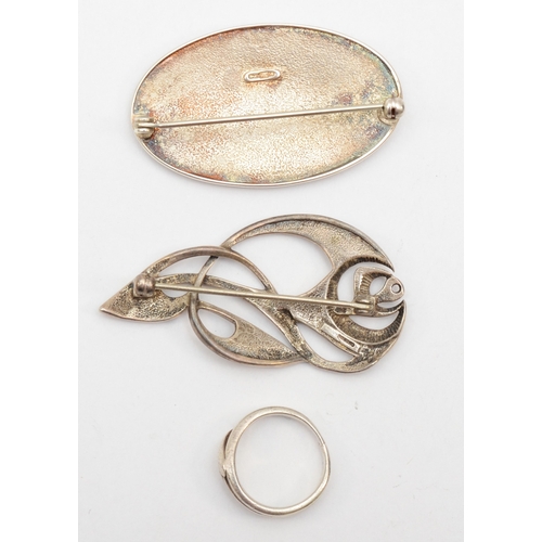 170 - Ola Gorie, two Scottish silver brooches to include a floral example, 48 x 23mm, together with a sliv... 