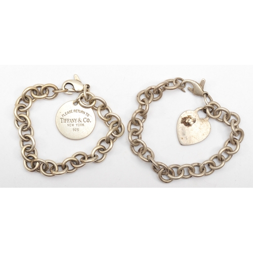 177 - Tiffany & Co, a silver identity bracelet with heart shaped tag, 19cm, together with another similar ... 