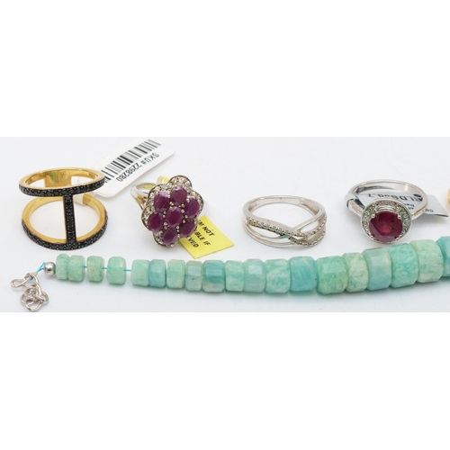 185 - Eight silver gem set rings to include ruby, and a bracelet,