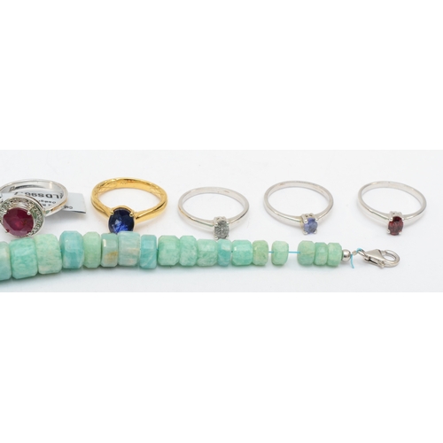 185 - Eight silver gem set rings to include ruby, and a bracelet,