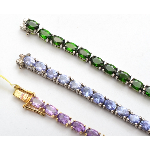 187 - Three silver gem set tennis bracelets to include amethyst, 18cm, 30gm.