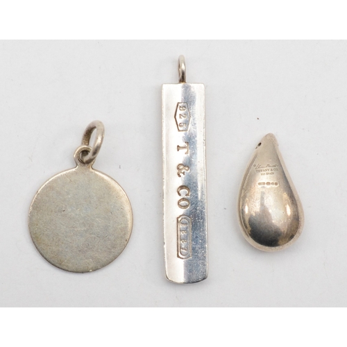 189 - Tiffany & Co, three silver pendants, longest 41mm, 21gm.