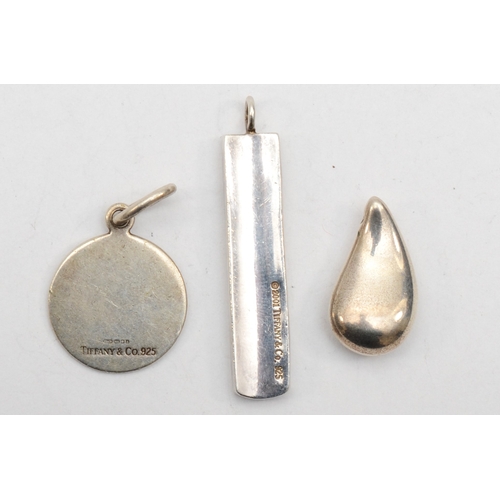 189 - Tiffany & Co, three silver pendants, longest 41mm, 21gm.