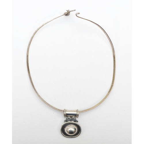 193 - Silvarious, a silver modernist pendant 38 x 28mm, on a torque necklace, 37gm.