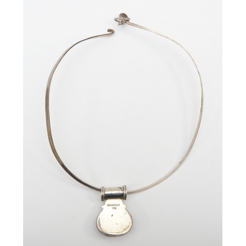 193 - Silvarious, a silver modernist pendant 38 x 28mm, on a torque necklace, 37gm.