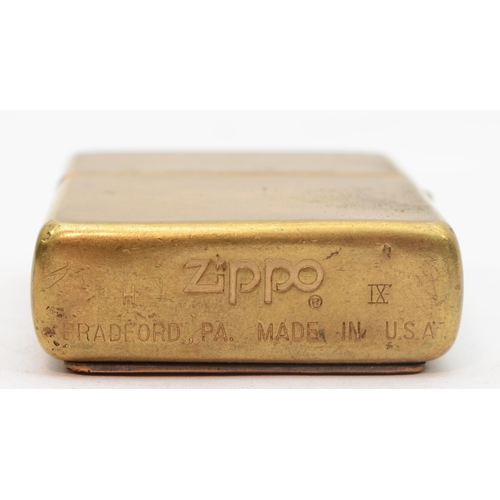 132 - Zippo, a brass petrol lighter with a long haired lady and H D.