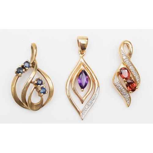 210 - A 9ct gold sapphire pendant, 20 x 13mm, together with two 375 gold amethyst and garnet pendants, 3.7... 