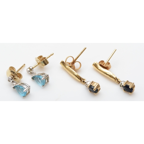 211 - A pair of 375 gold topaz drop stud earrings, 9mm, and a sapphire pair, 2.4gm.