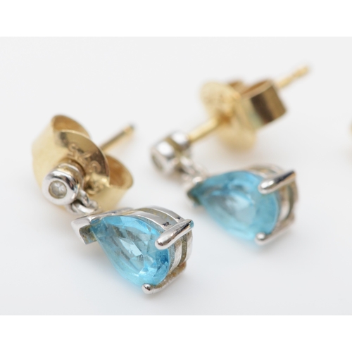 211 - A pair of 375 gold topaz drop stud earrings, 9mm, and a sapphire pair, 2.4gm.