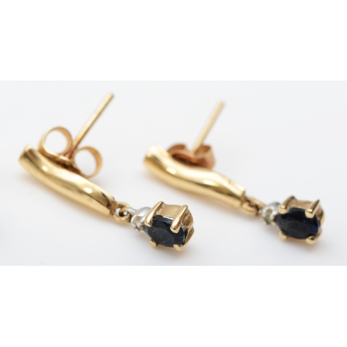 211 - A pair of 375 gold topaz drop stud earrings, 9mm, and a sapphire pair, 2.4gm.