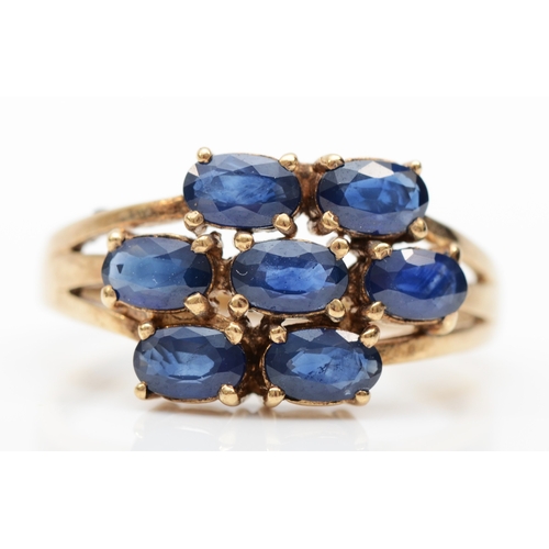 213 - A 375 gold sapphire cluster ring, N, 3.1gm.