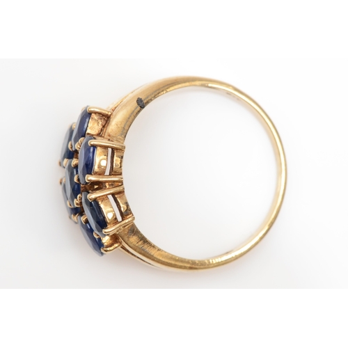 213 - A 375 gold sapphire cluster ring, N, 3.1gm.