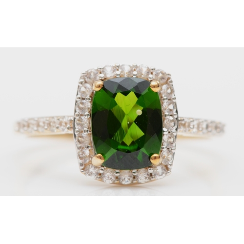 216 - A 9ct gold diopside and white sapphire dress ring, S, 2.7gm.