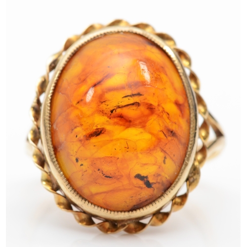 217 - A 9ct gold Baltic amber dress ring, 21 x 17mm, N, 6.2gm.